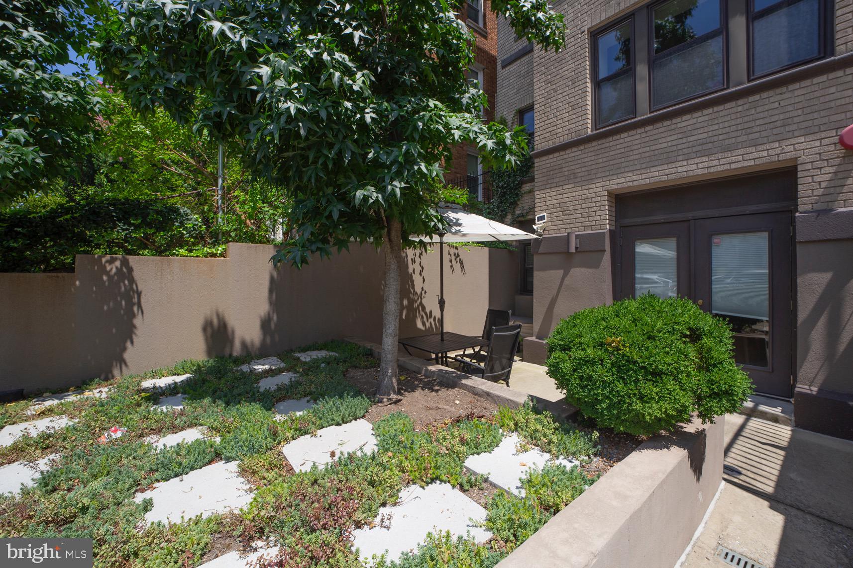 3511 13th Street Northwest, Unit 102 Washington, DC 20010 - Photo 13 of 23 a front view of a house with garden