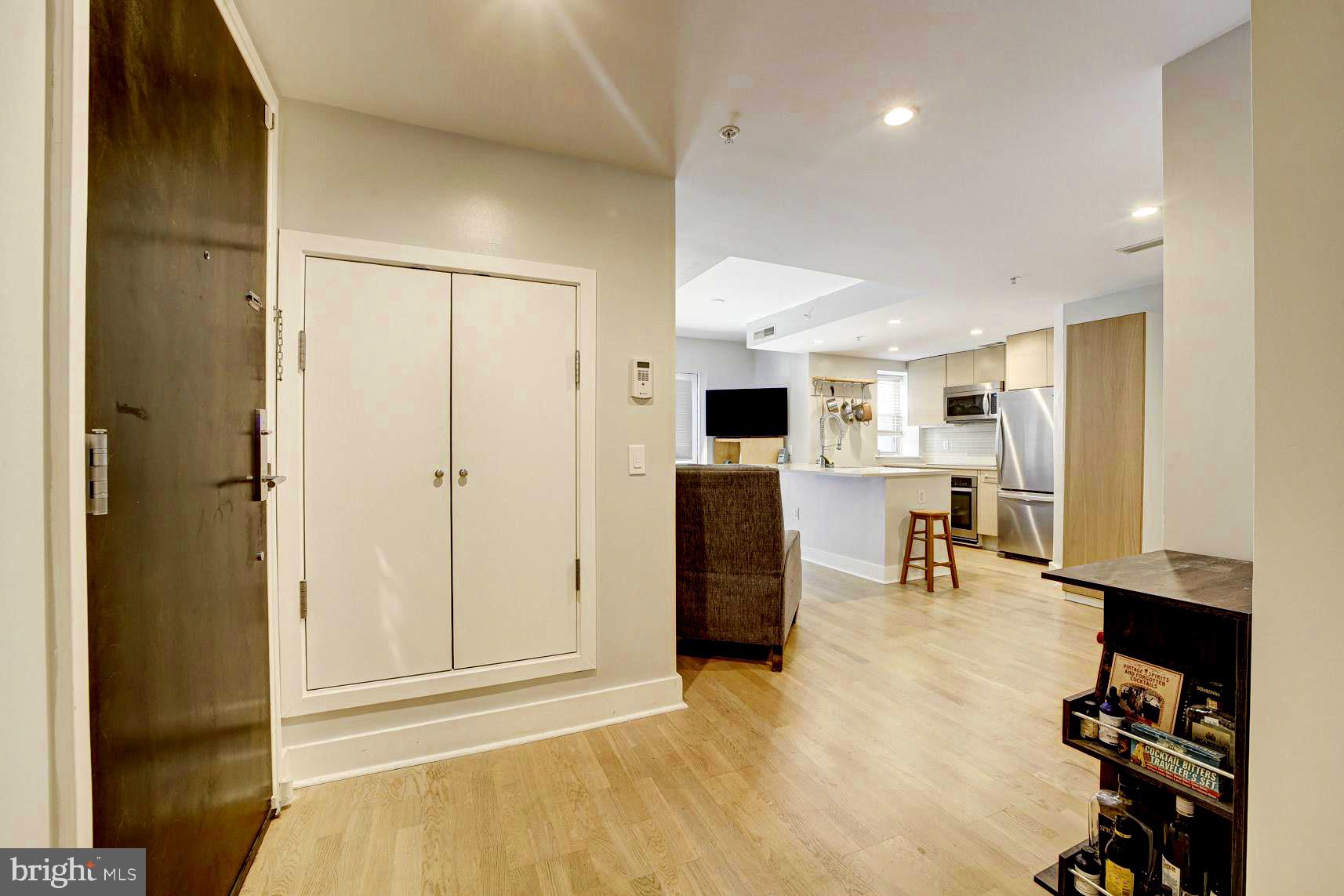 3511 13th Street Northwest, Unit 102 Washington, DC 20010 - Photo 23 of 23 a view of kitchen with furniture and refrigerator