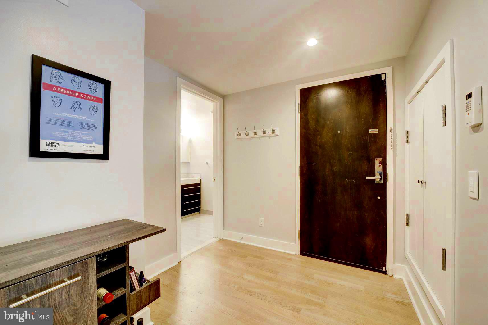 3511 13th Street Northwest, Unit 102 Washington, DC 20010 - Photo 7 of 23 wooden floor in an empty room with a fireplace