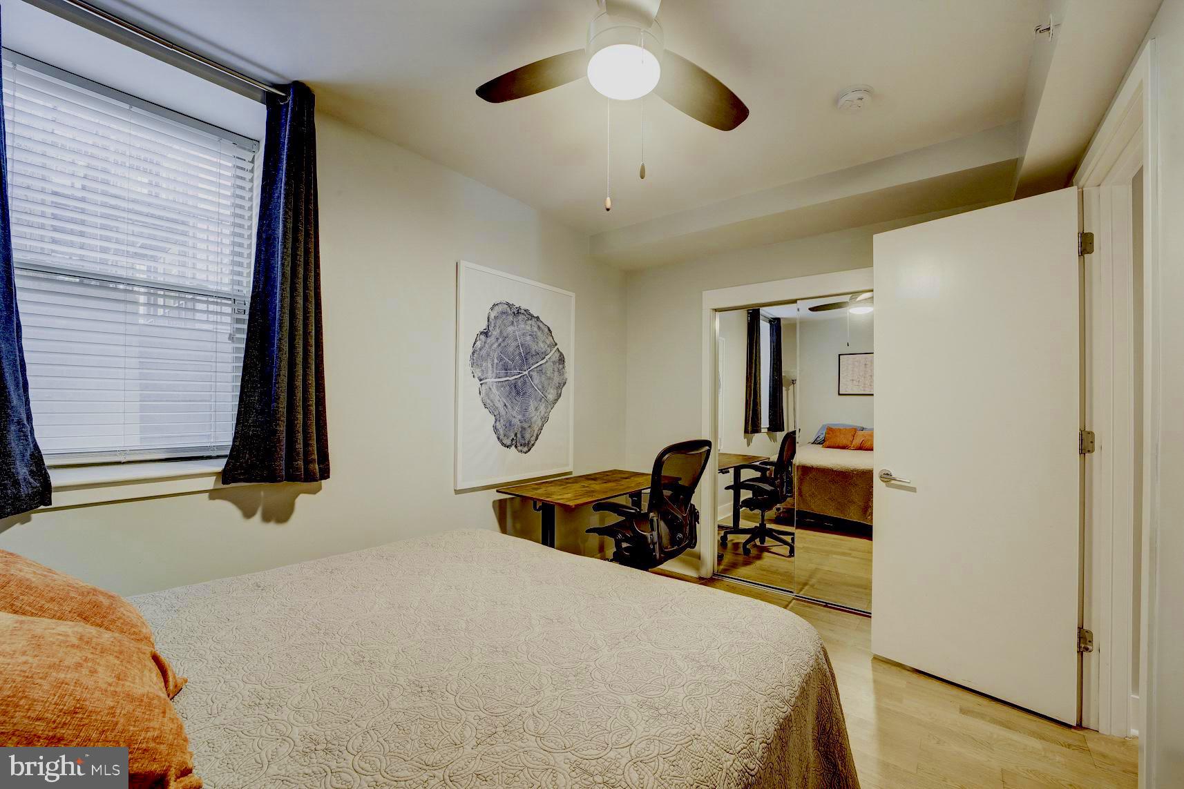 3511 13th Street Northwest, Unit 102 Washington, DC 20010 - Photo 8 of 23 a bedroom with furniture and a window
