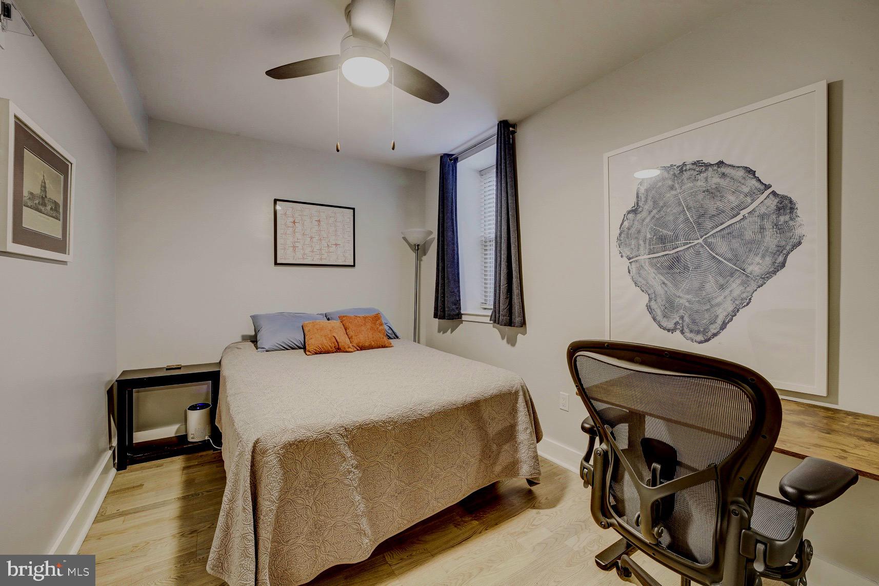 3511 13th Street Northwest, Unit 102 Washington, DC 20010 - Photo 9 of 23 a bedroom with furniture and a bed