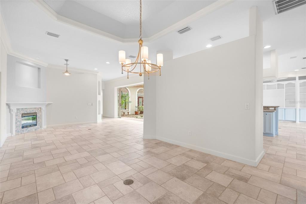 8356 Mareva Lane Sarasota, FL 34241 - Photo 13 of 44 a view of a big room with chandelier and windows