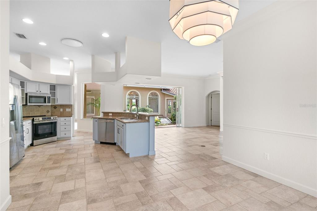 8356 Mareva Lane Sarasota, FL 34241 - Photo 17 of 44 a large kitchen with a large counter top and stainless steel appliances