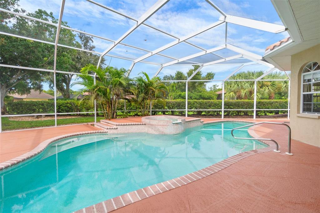 8356 Mareva Lane Sarasota, FL 34241 - Photo 24 of 44 a view of a backyard with swimming pool and sitting area