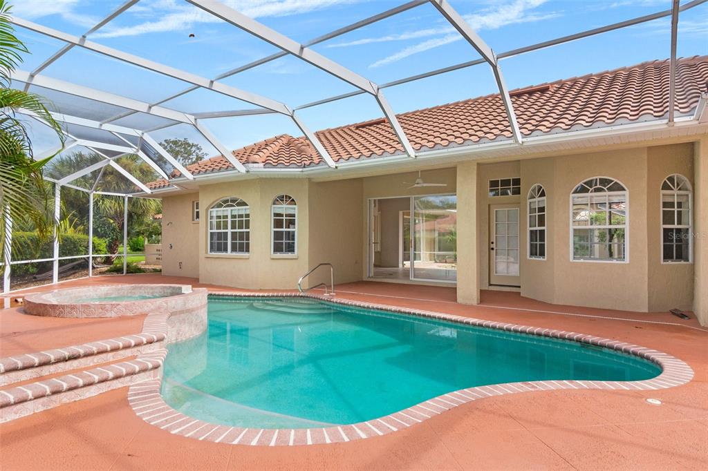 8356 Mareva Lane Sarasota, FL 34241 - Photo 25 of 44 a view of a house with pool and porch