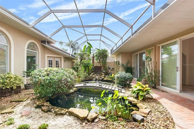 a view of a chairs and table in a patio