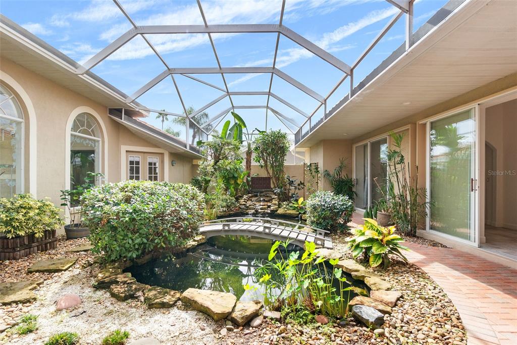 8356 Mareva Lane Sarasota, FL 34241 - Photo 4 of 44 a view of a chairs and table in a patio