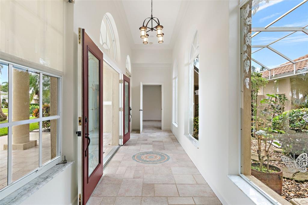 8356 Mareva Lane Sarasota, FL 34241 - Photo 8 of 44 a view of a hallway with windows