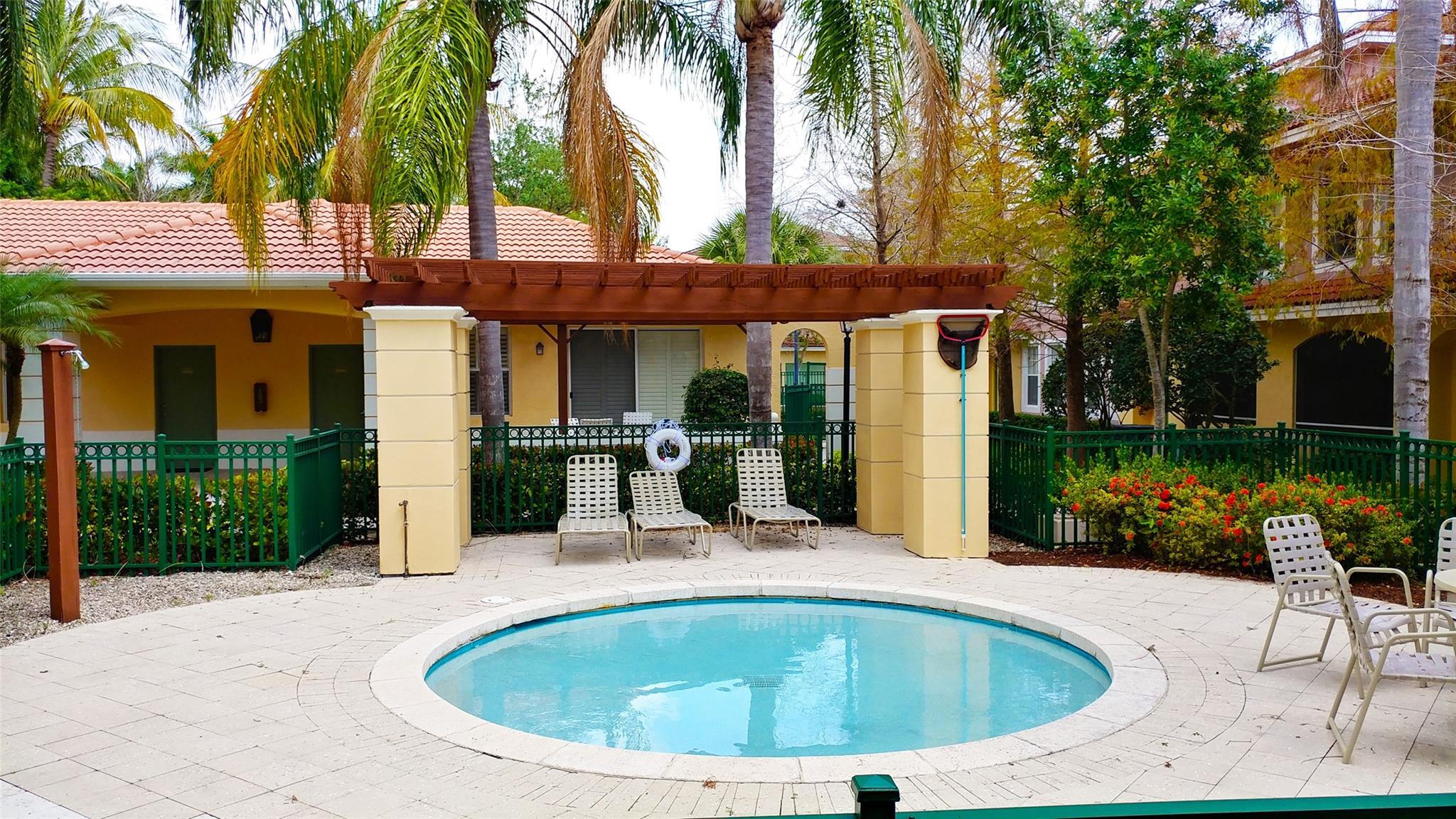 6906 West Sample Road, Unit 6906 Pompano Beach, FL 33063 - Photo 10 of 10 a view of outdoor space yard swimming pool and patio
