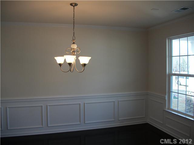 1240 Screech Owl Road Waxhaw, NC 28173 - Photo 2 of 14 a room with a window and ceiling fan