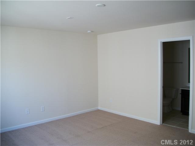 1240 Screech Owl Road Waxhaw, NC 28173 - Photo 7 of 14 wooden floor in an empty room