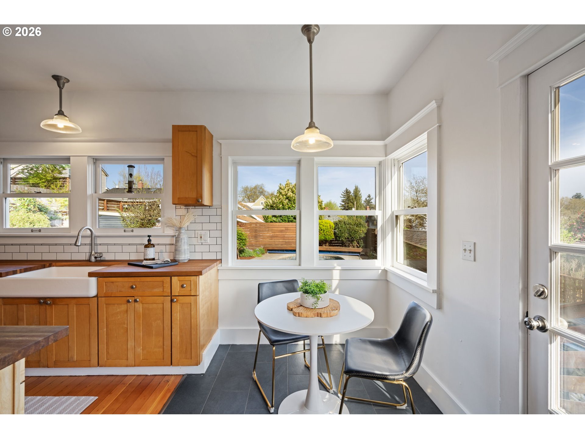 316 Northeast 44th Avenue Portland, OR 97213 - Photo 12 of 43 a kitchen with a table and chairs in it