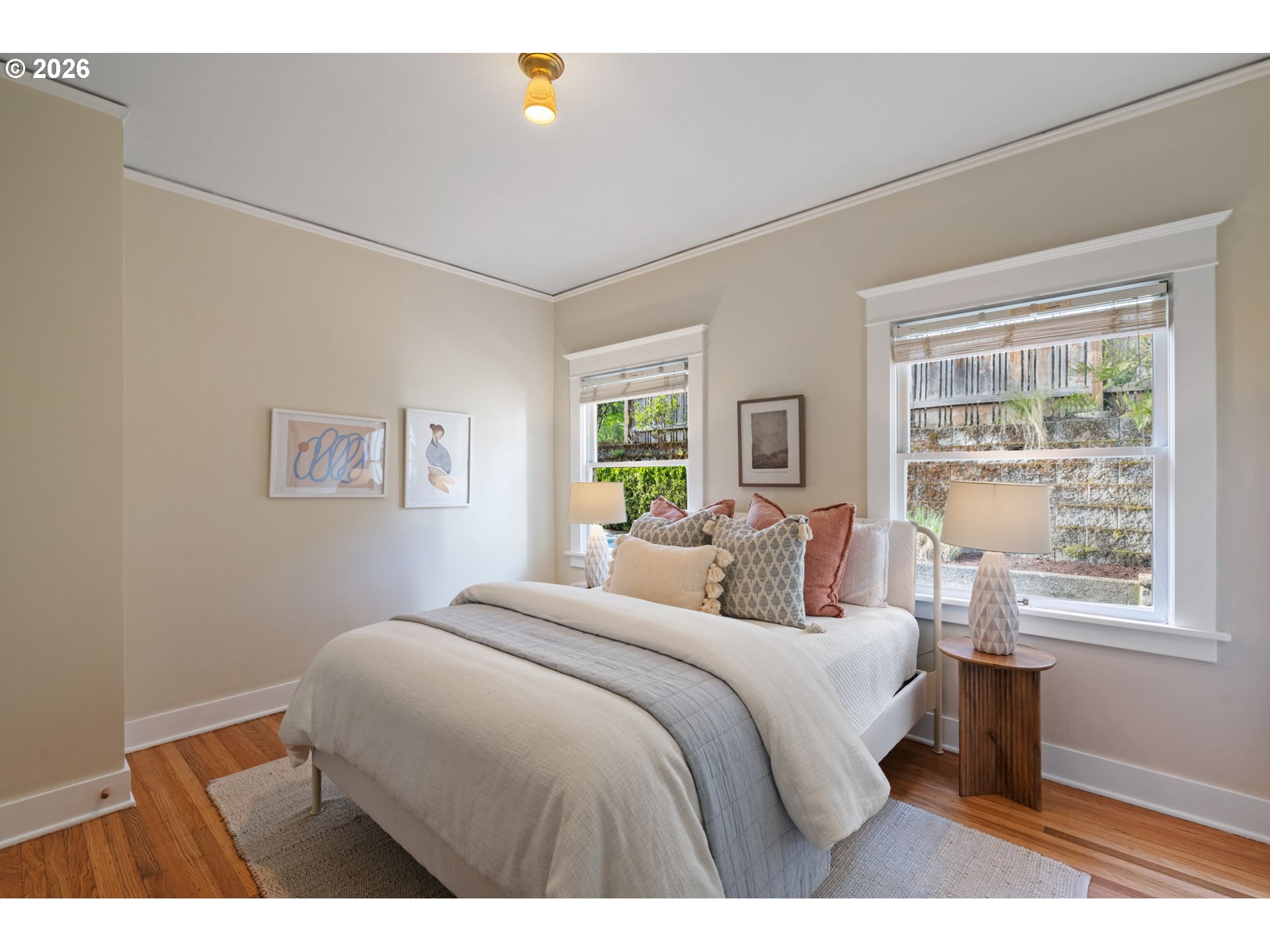316 Northeast 44th Avenue Portland, OR 97213 - Photo 16 of 43 a bedroom with a bed and a large window