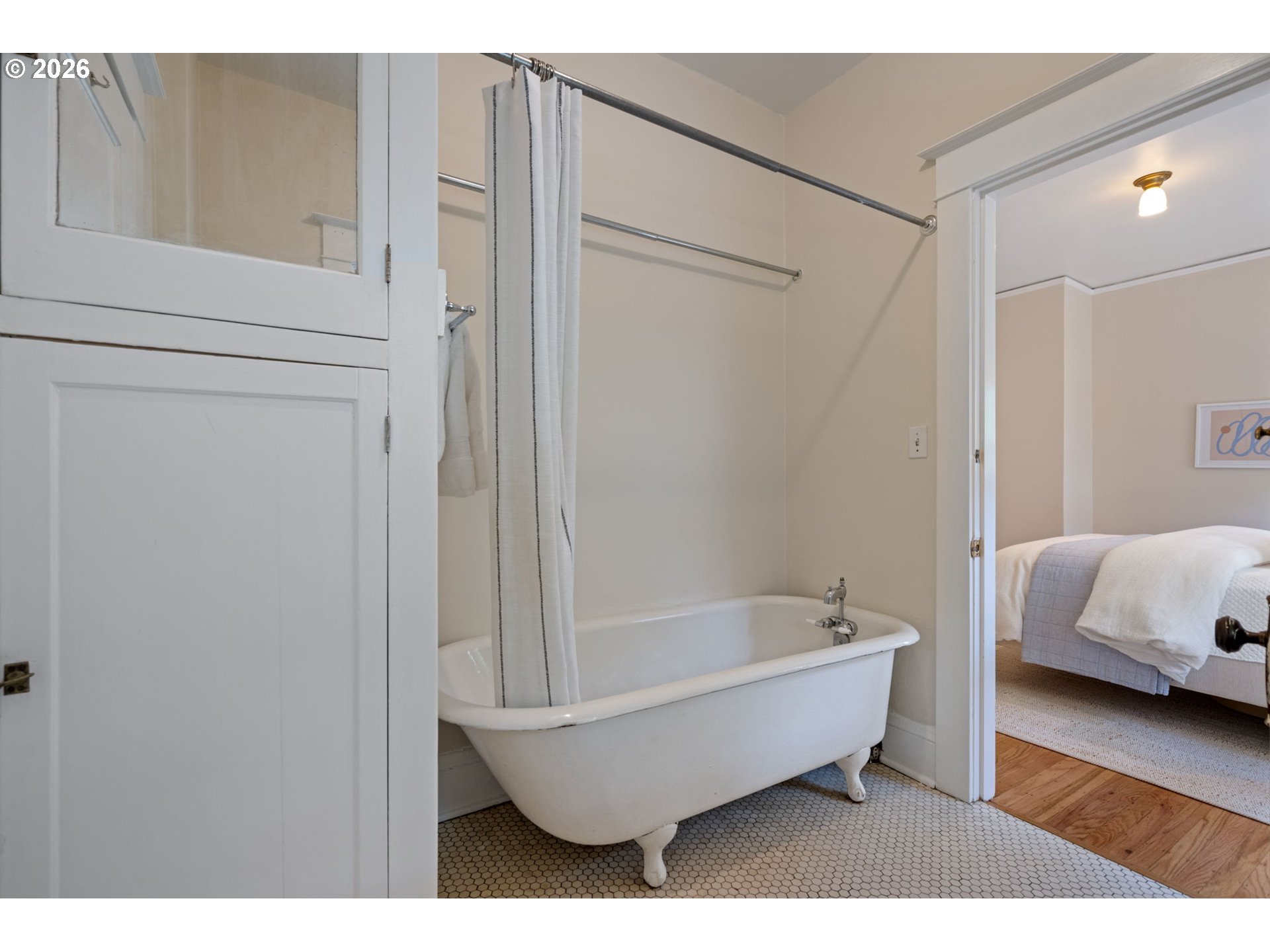 316 Northeast 44th Avenue Portland, OR 97213 - Photo 17 of 43 a bathroom with a bathtub and a walk in closet