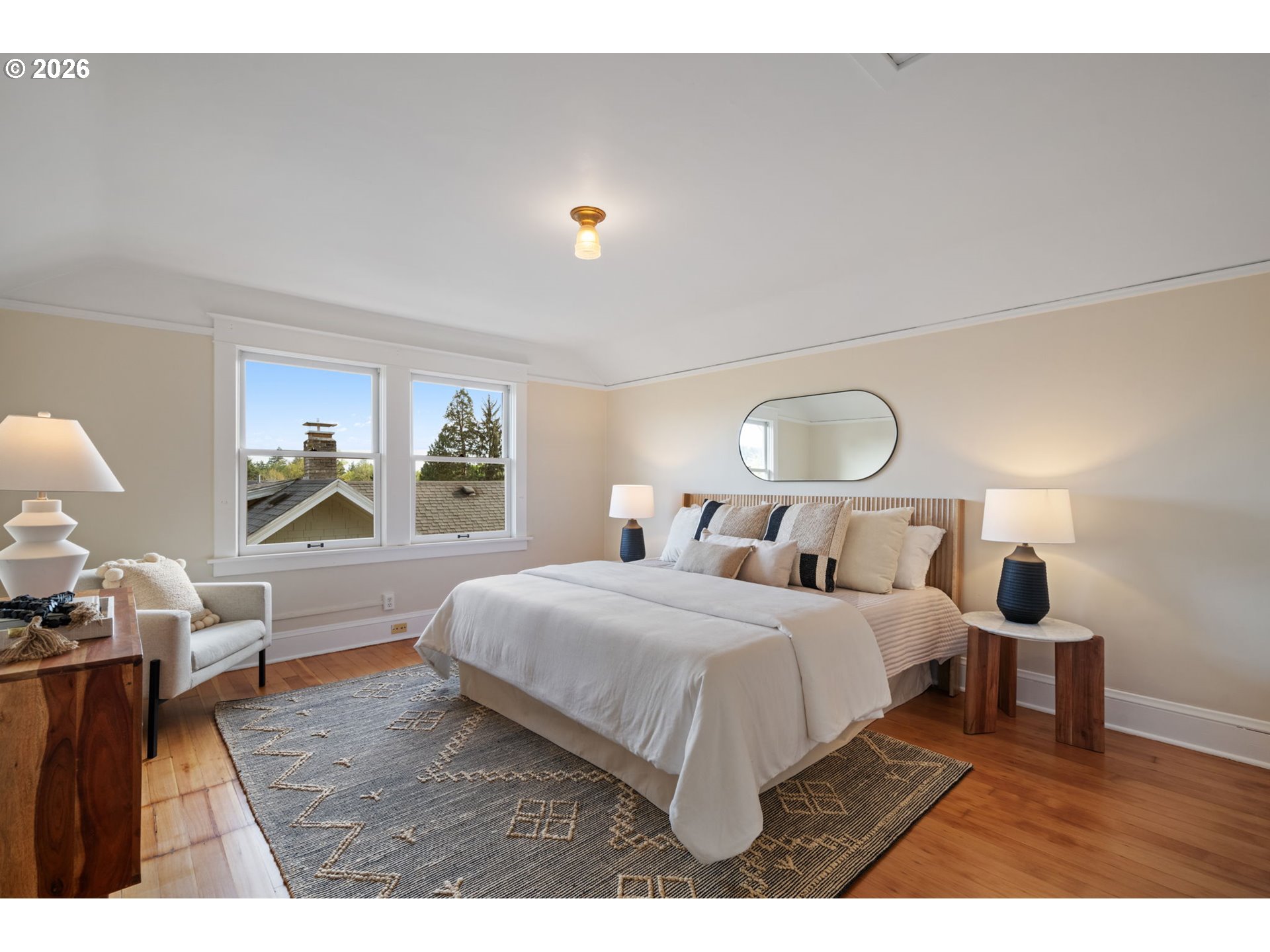 316 Northeast 44th Avenue Portland, OR 97213 - Photo 18 of 43 a bedroom with a bed and wooden floor