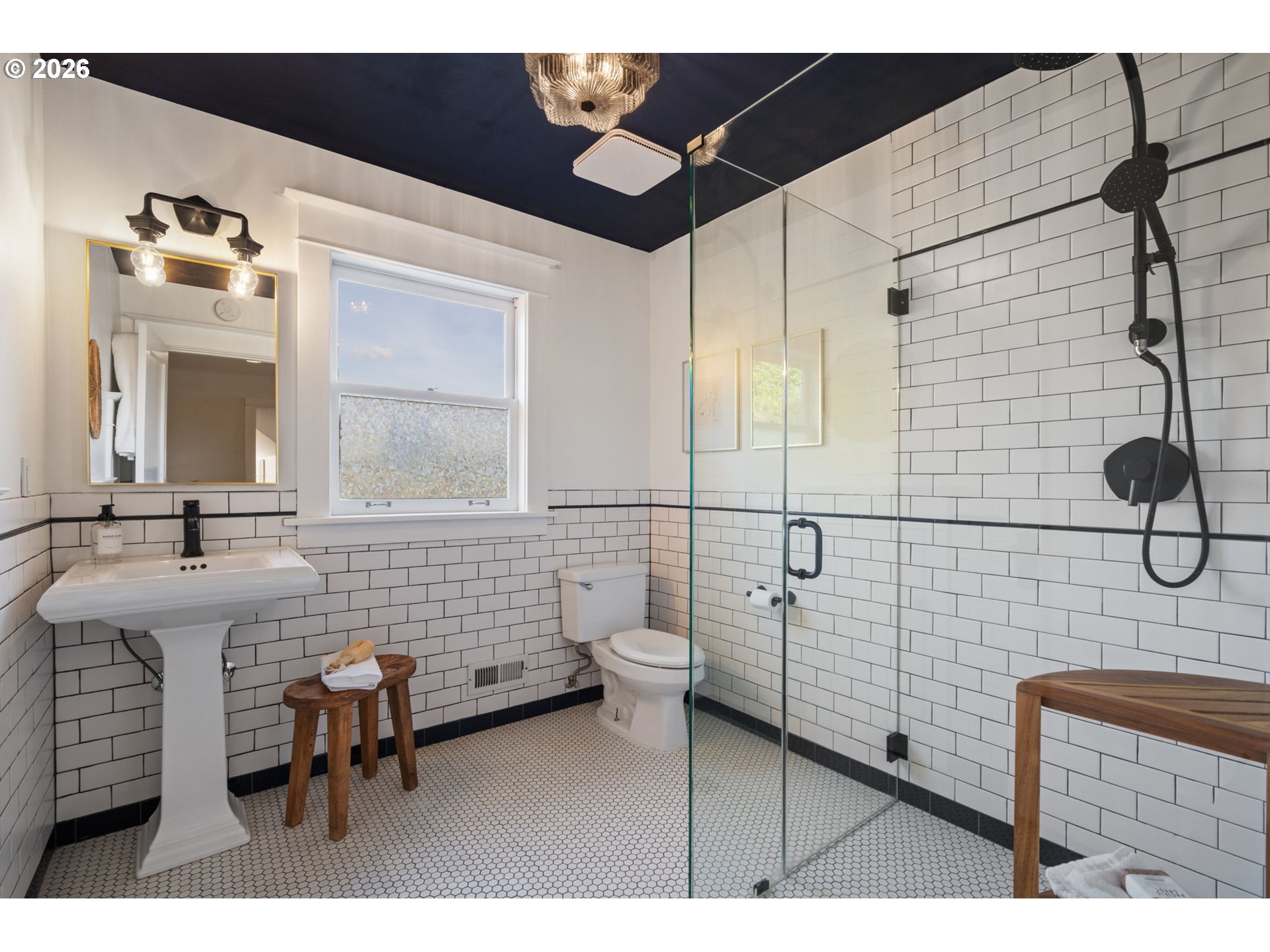 316 Northeast 44th Avenue Portland, OR 97213 - Photo 19 of 43 a bathroom with a sink mirror and a shower