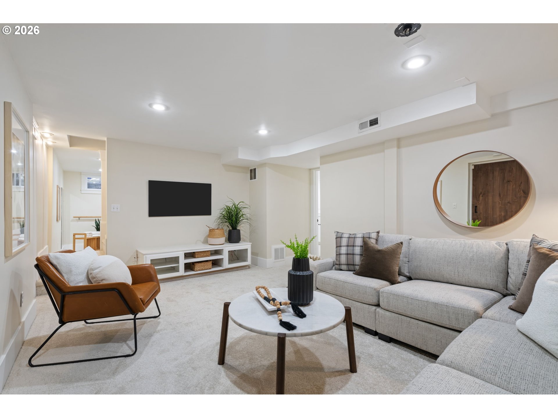 316 Northeast 44th Avenue Portland, OR 97213 - Photo 26 of 43 a living room with furniture and a flat screen tv
