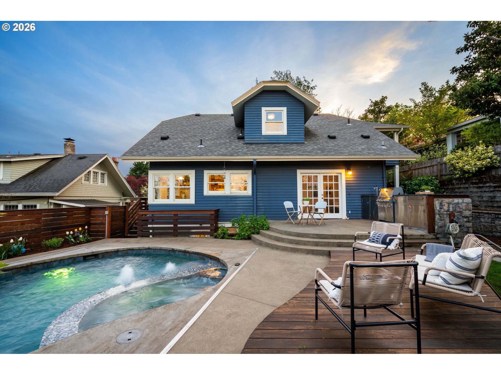 316 Northeast 44th Avenue Portland, OR 97213 - Photo 32 of 43 a front view of a house with a yard table and chairs