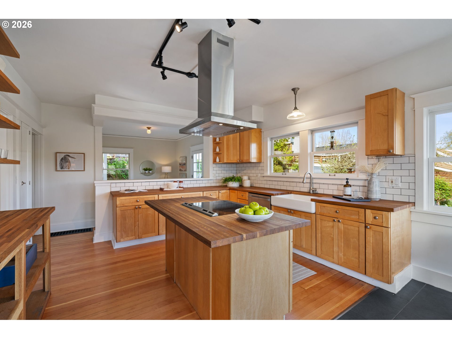 316 Northeast 44th Avenue Portland, OR 97213 - Photo 8 of 43 a kitchen with stainless steel appliances granite countertop a sink a stove and a wooden floors