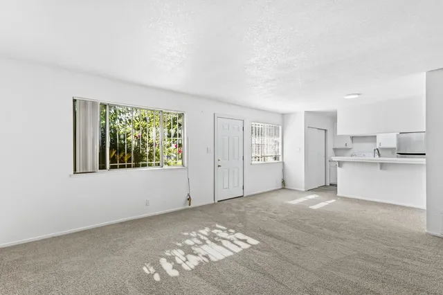 a view of kitchen with center island and stainless steel appliances