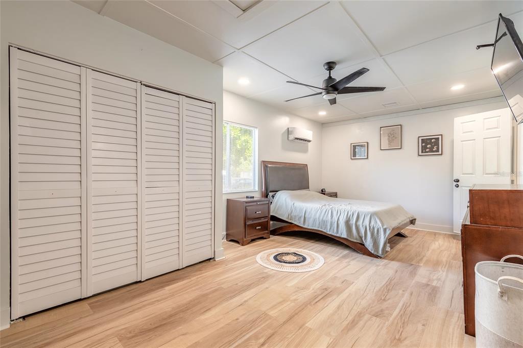 1804 Mango Tree Drive Edgewater, FL 32132 - Photo 15 of 43 a bedroom with a bed and a ceiling fan