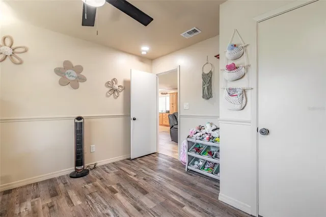 a room with furniture and wooden floor