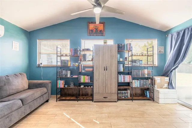 a living room with furniture and a window