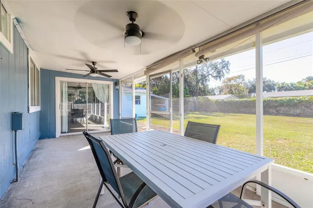 a view of a dining room with furniture window and outside view