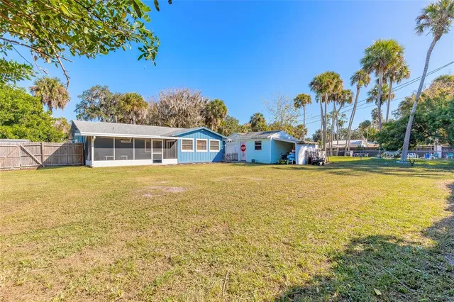 a house view with swimming pool in front