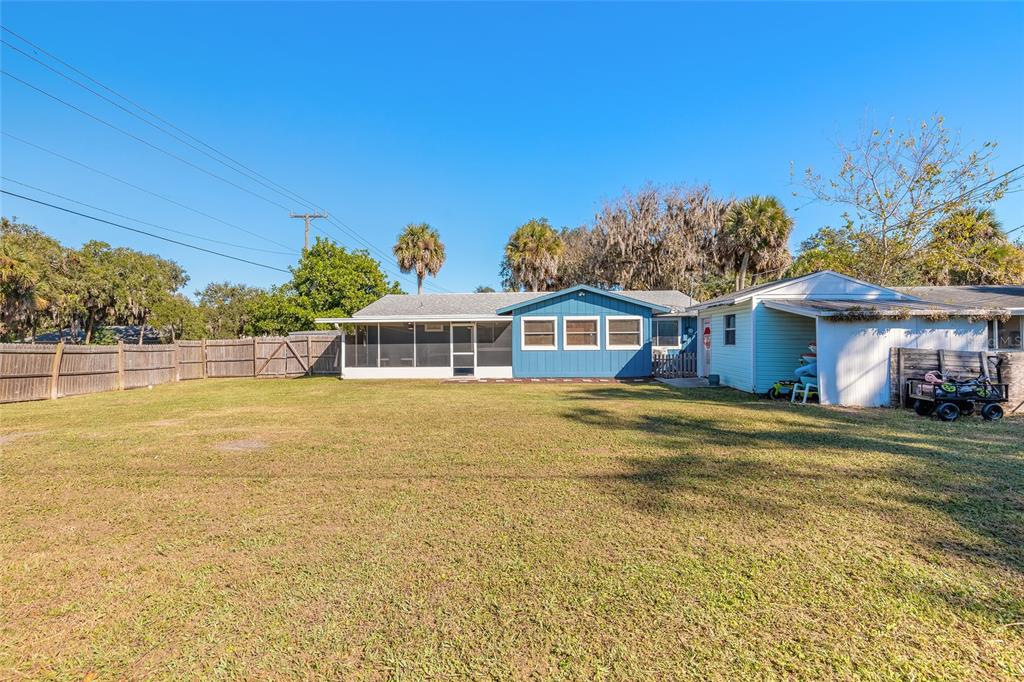 1804 Mango Tree Drive Edgewater, FL 32132 - Photo 29 of 43 a front view of a house with a garden