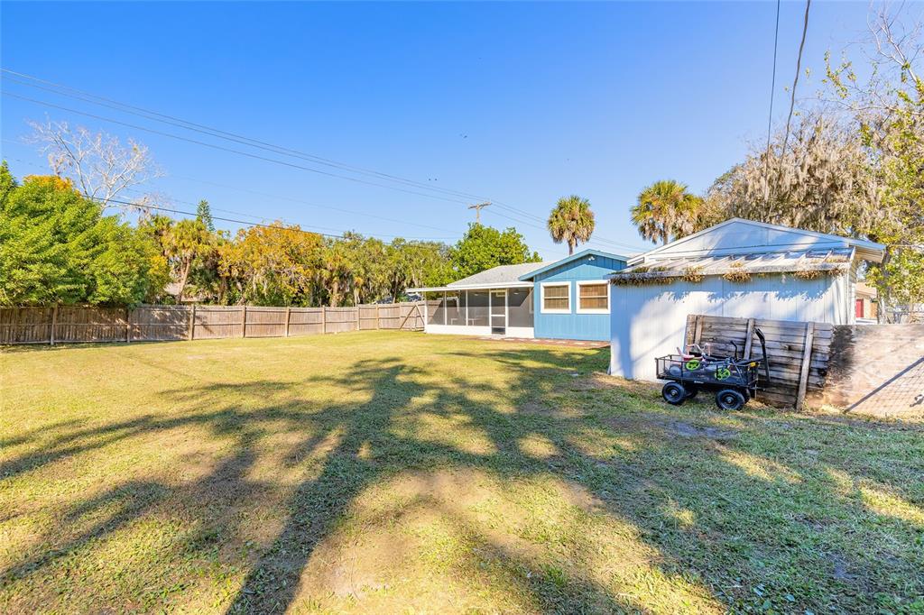1804 Mango Tree Drive Edgewater, FL 32132 - Photo 30 of 43 a view of a house with a yard