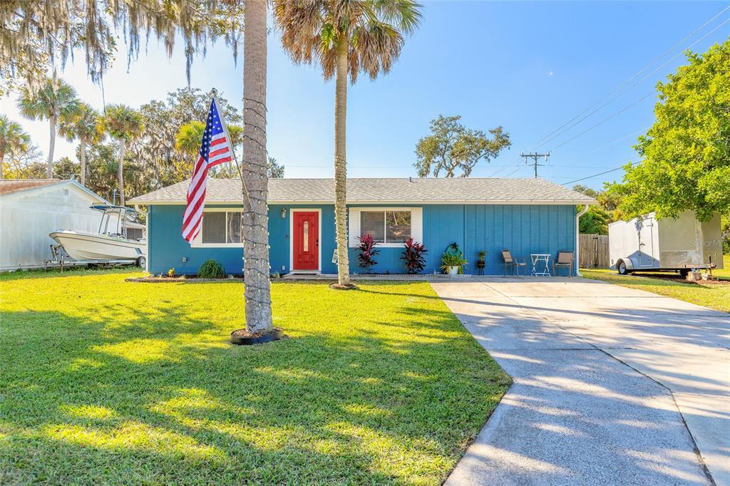 1804 Mango Tree Drive Edgewater, FL 32132 - Photo 32 of 43 a swimming pool with yard and outdoor seating