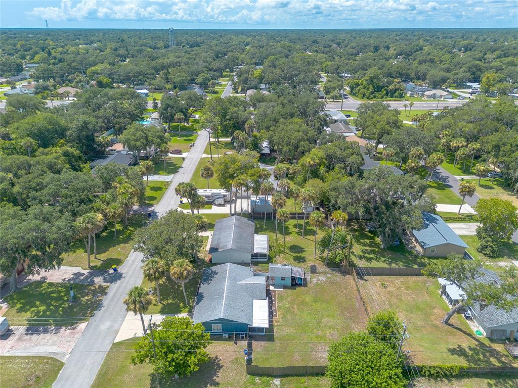 1804 Mango Tree Drive Edgewater, FL 32132 - Photo 38 of 43 an aerial view of residential houses with outdoor space and trees