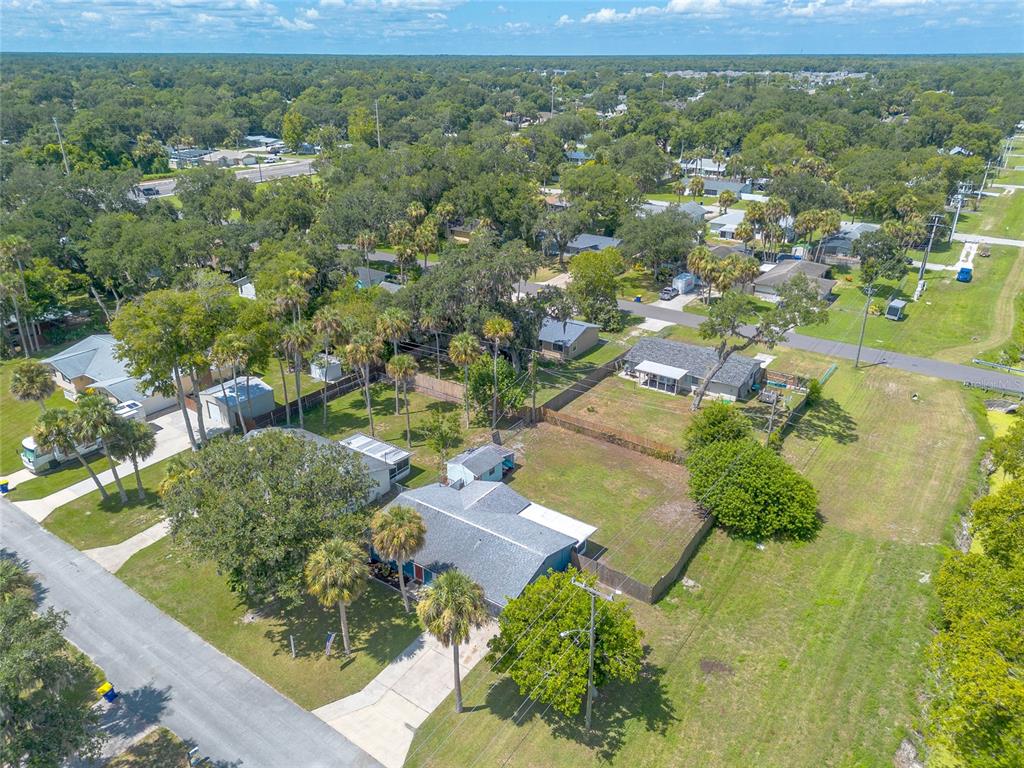 1804 Mango Tree Drive Edgewater, FL 32132 - Photo 39 of 43 an aerial view of residential houses with outdoor space and trees
