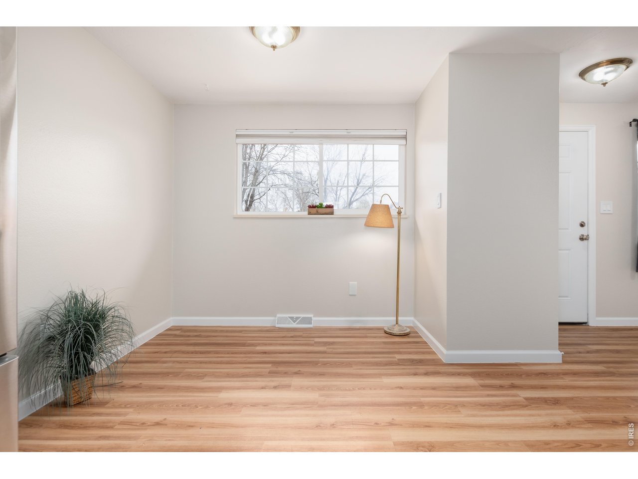 439 Dickson Street Longmont, CO 80504 - Photo 10 of 31 a view of empty room with wooden floor