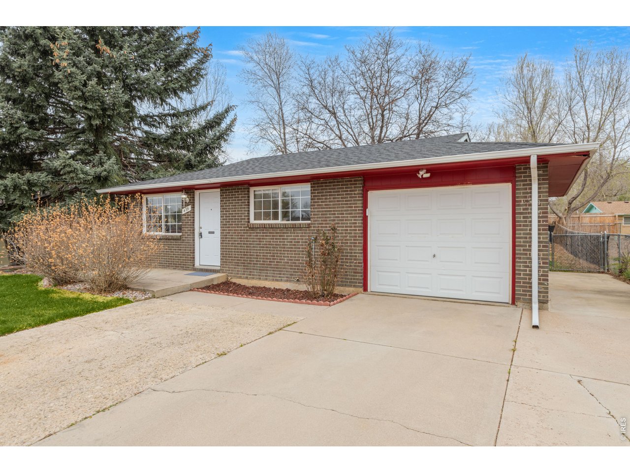 439 Dickson Street Longmont, CO 80504 - Photo 2 of 31 a view of garage and yard