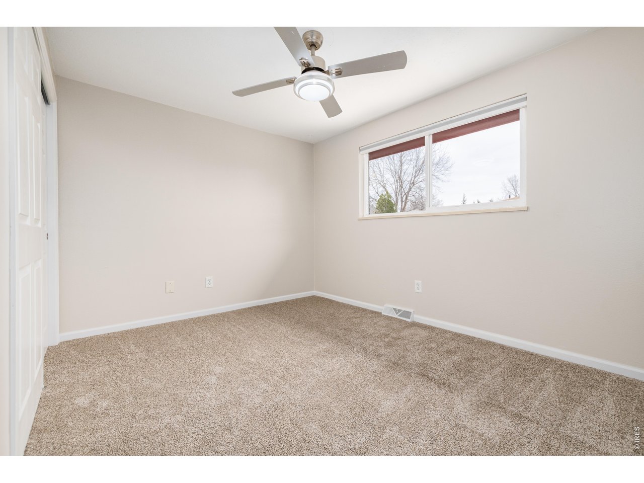 439 Dickson Street Longmont, CO 80504 - Photo 20 of 31 a view of an empty room with a window