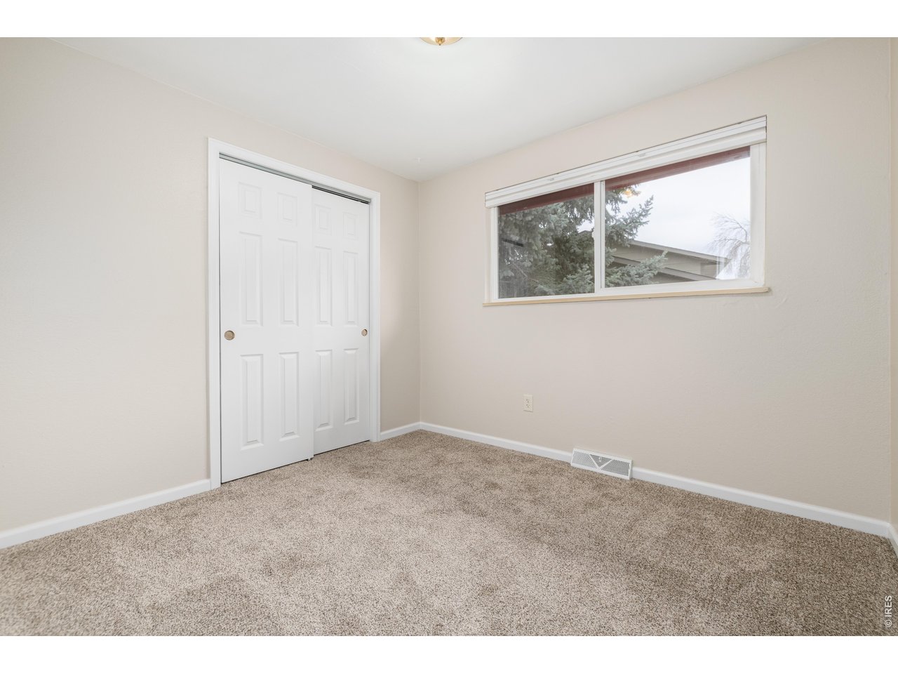 439 Dickson Street Longmont, CO 80504 - Photo 21 of 31 an empty room with a window