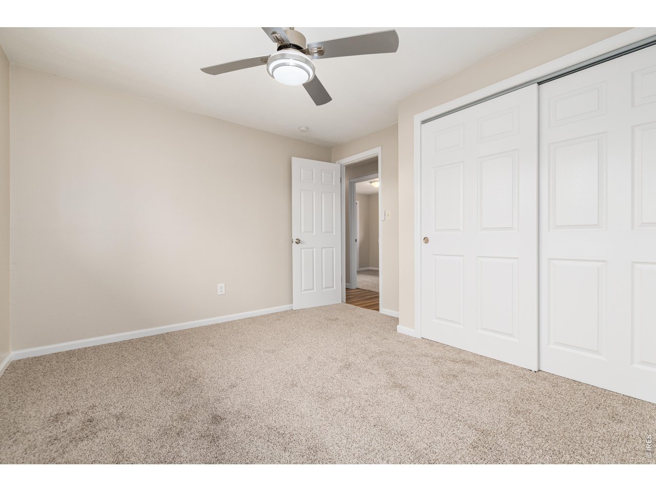 439 Dickson Street Longmont, CO 80504 - Photo 24 of 31 a view of empty room with a ceiling fan
