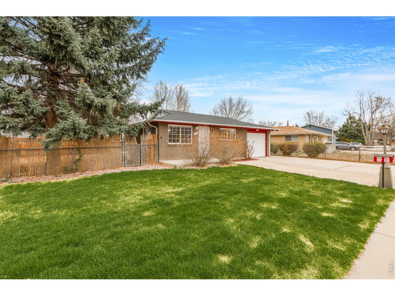 439 Dickson Street Longmont, CO 80504 - Photo 3 of 31 a view of a house with a yard and sitting area