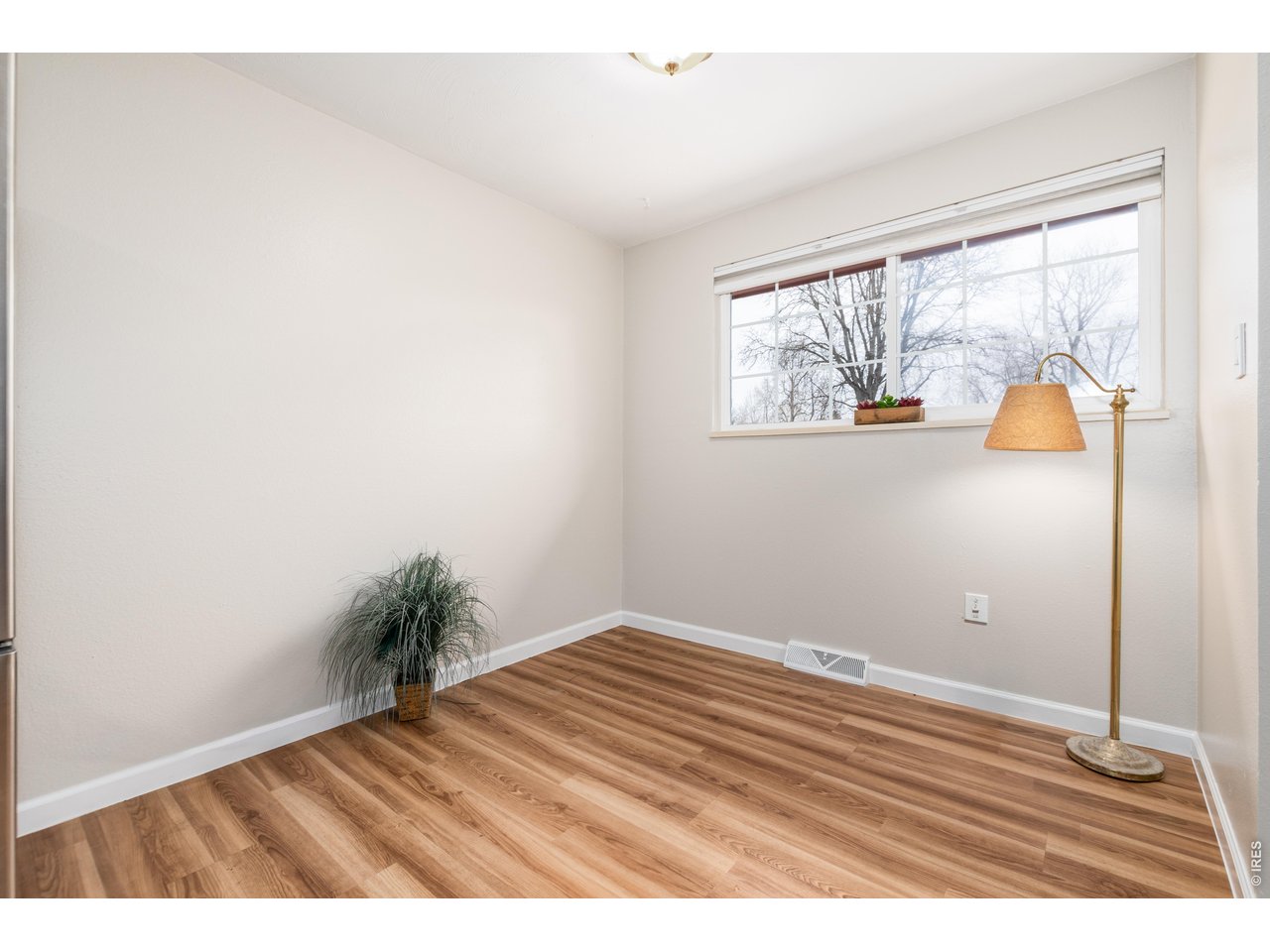 439 Dickson Street Longmont, CO 80504 - Photo 9 of 31 a view of an empty room and window