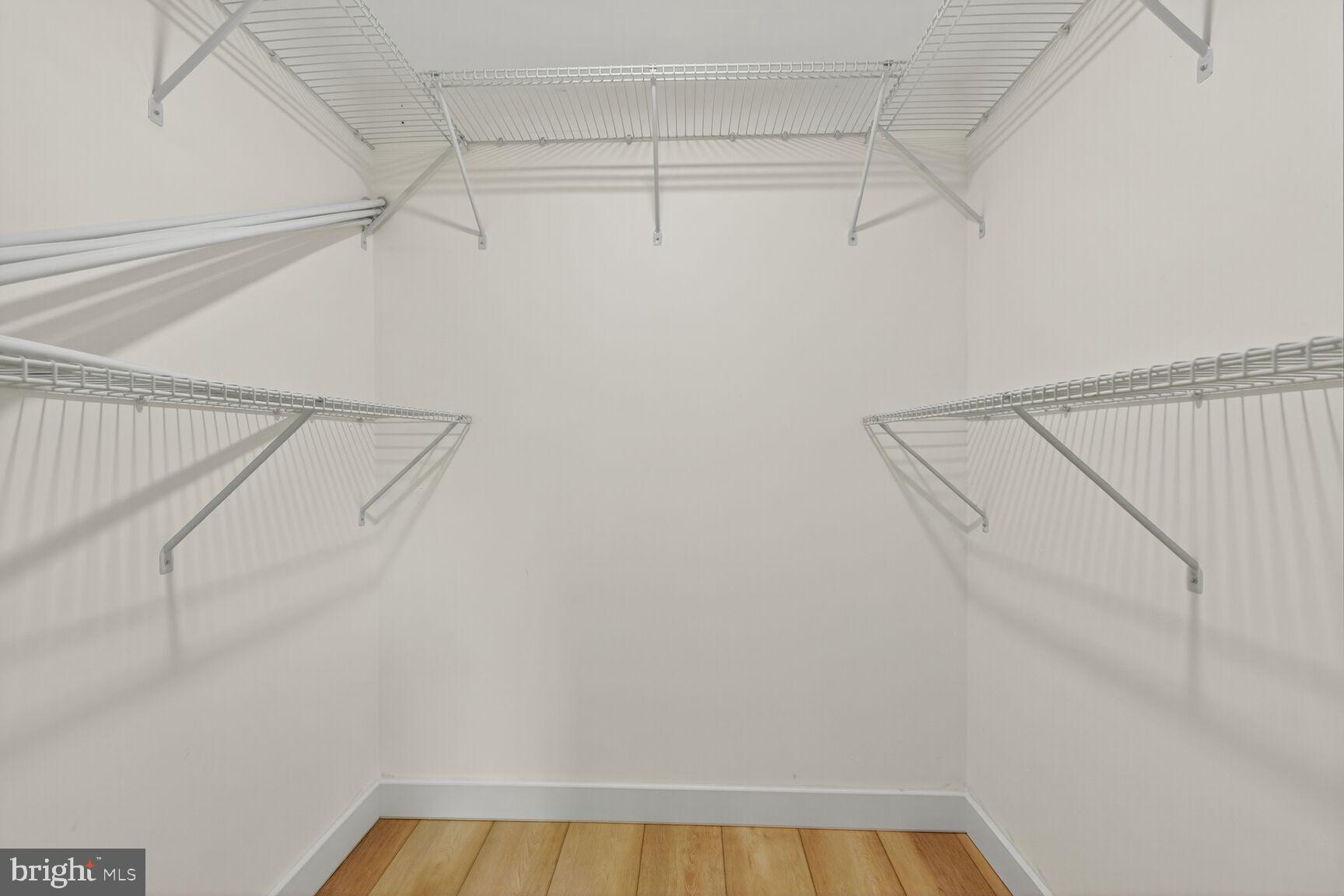 2208 Castle Rock Square, Unit 2B Reston, VA 20191 - Photo 18 of 51 a view of a room with racks on the wall