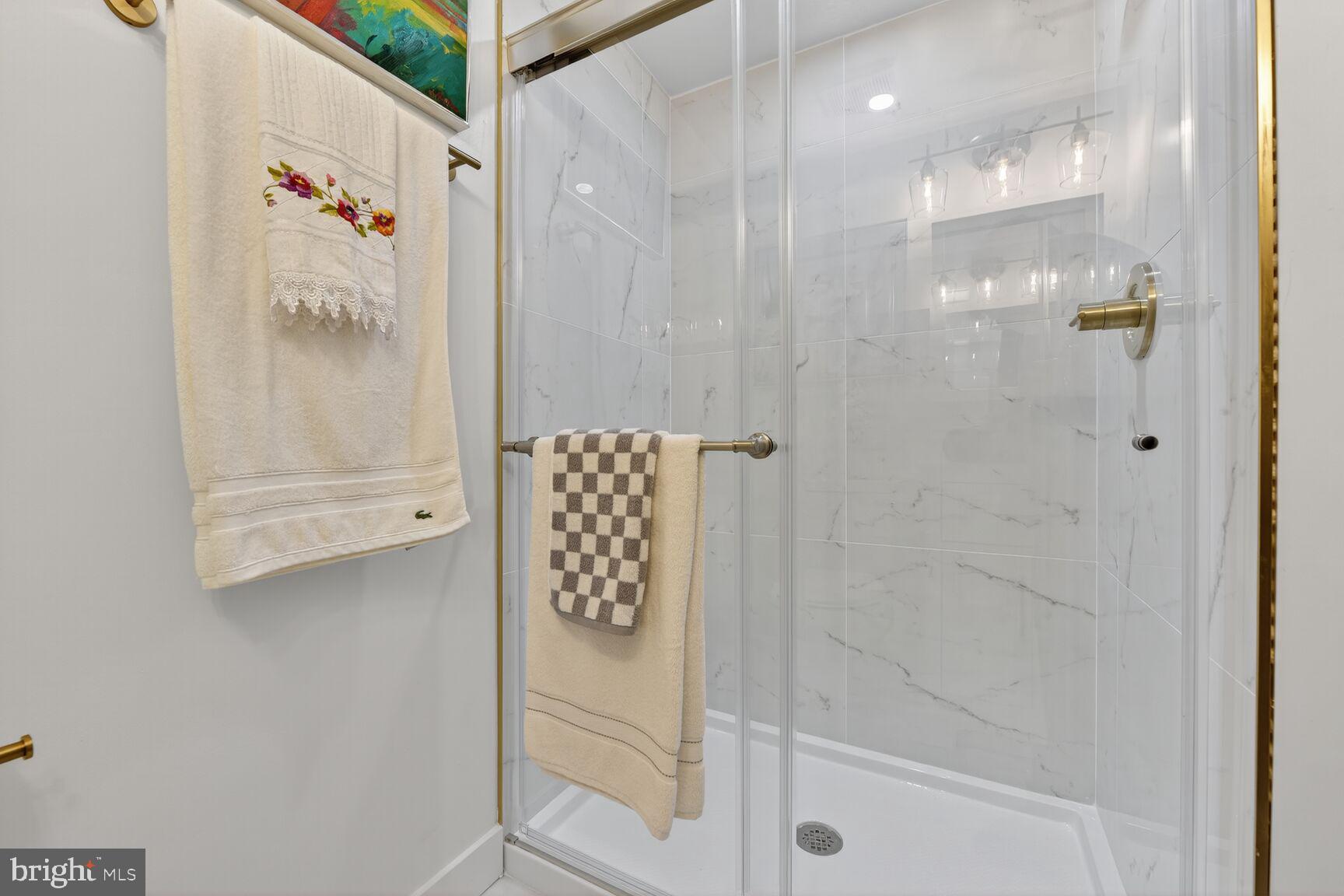 2208 Castle Rock Square, Unit 2B Reston, VA 20191 - Photo 24 of 51 a bathroom with a shower