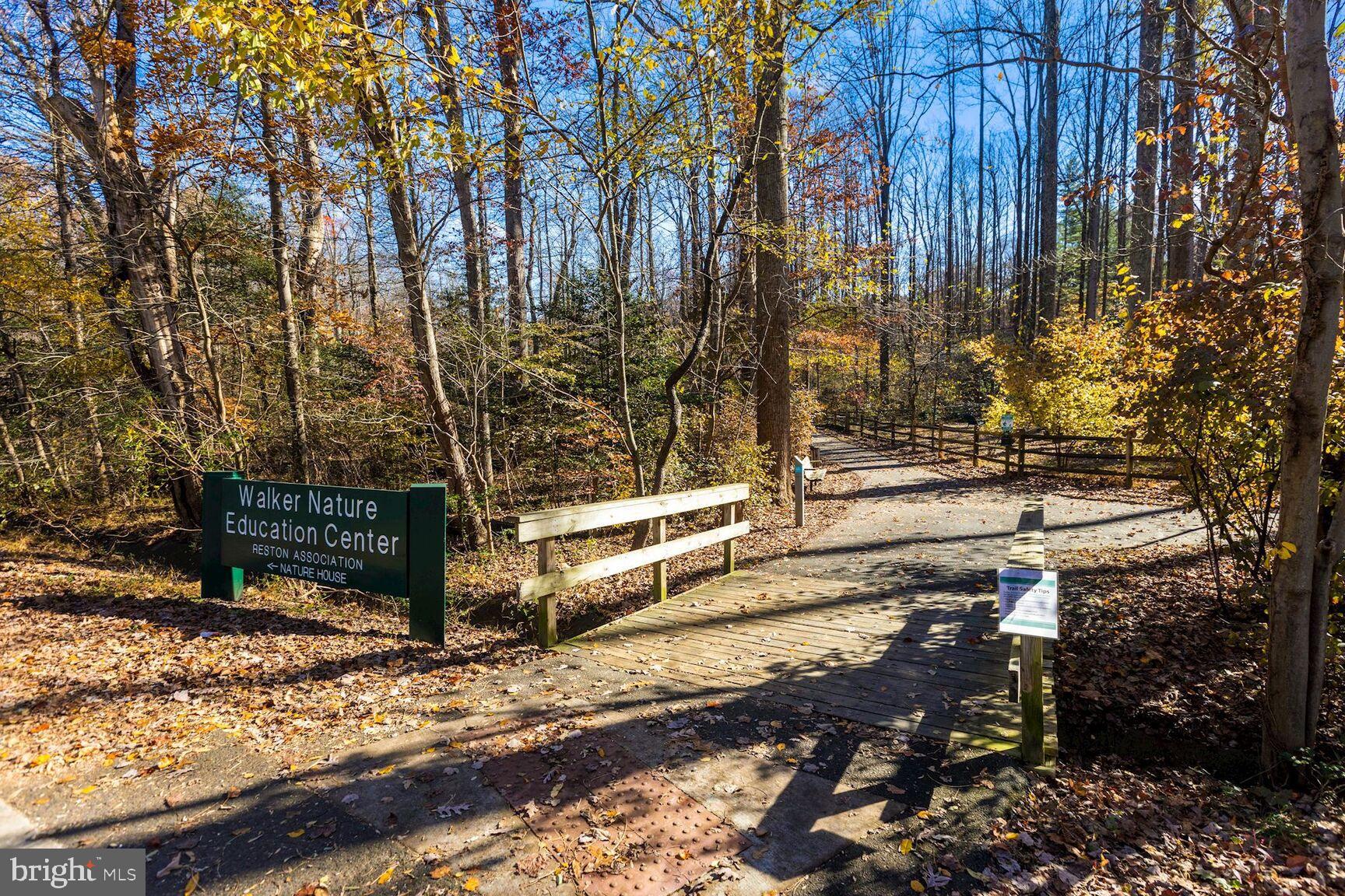 2208 Castle Rock Square, Unit 2B Reston, VA 20191 - Photo 29 of 51 a view of a street with large trees
