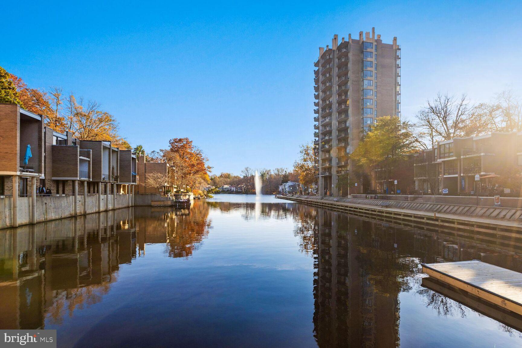 2208 Castle Rock Square, Unit 2B Reston, VA 20191 - Photo 44 of 51 a view of a lake with a large building