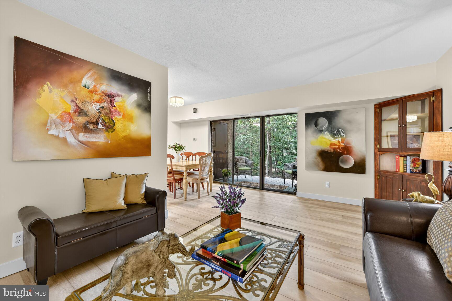 2208 Castle Rock Square, Unit 2B Reston, VA 20191 - Photo 5 of 51 a living room with furniture and a large window