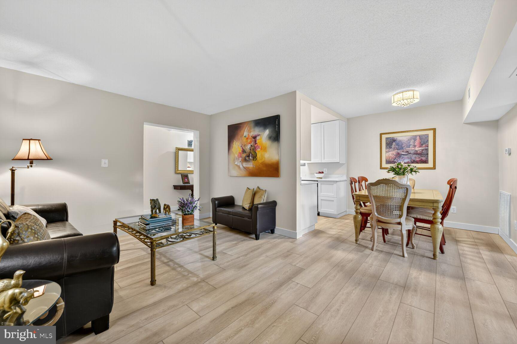 2208 Castle Rock Square, Unit 2B Reston, VA 20191 - Photo 7 of 51 a living room with furniture and wooden floor