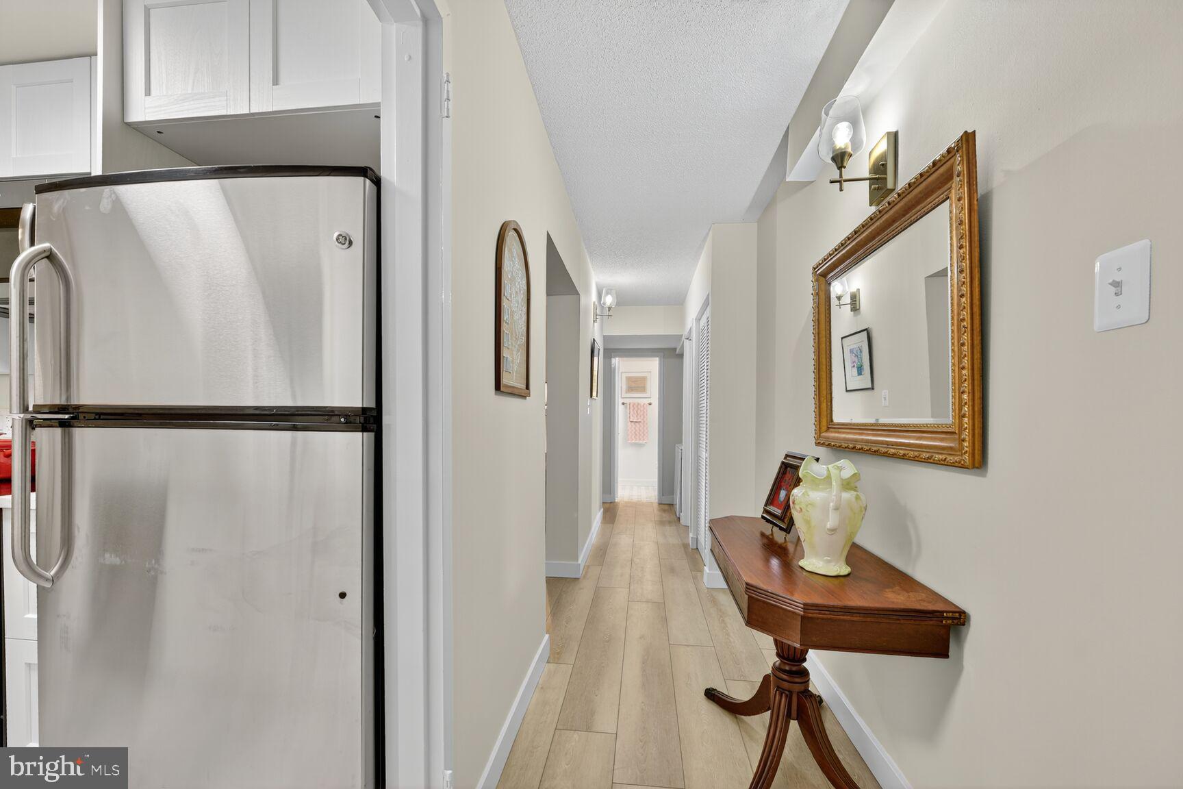 2208 Castle Rock Square, Unit 2B Reston, VA 20191 - Photo 10 of 51 a living room with furniture and a window