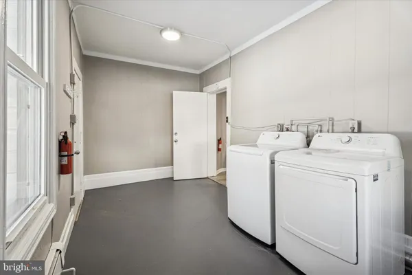 a utility room with dryer and washer