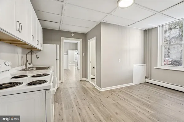 a view of a kitchen with wooden floor